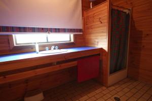 a bathroom with a sink and a window at At The Beach in Evergreen