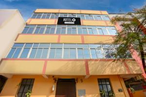 a building with a sign that reads mula center at Hotel O Patliputra Railway Station Formerly Rameshwaram Guest House in Dānāpur
