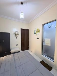 a living room with a large window and a door at MD Homes and Shortlet in Lagos
