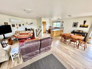 a living room with a couch and a table at Condon 53 in Evergreen