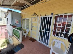 an outside view of a house with a door and a porch at Ann Dor #3 in San Andrés