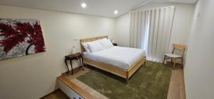 Postel nebo postele na pokoji v ubytování Maragoça AL