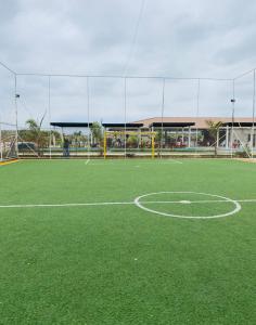 a soccer field with a soccer ball on it at Complejo Turístico Tierra Dorada in Manta