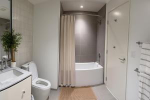 a bathroom with a tub and a toilet and a shower at Thrive Nest in San Francisco +9 photos