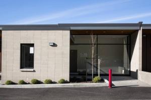 a building with a red pole in front of it at Hello QT Lakeside Gem in Queenstown
