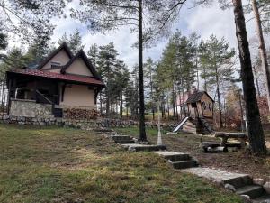 a small house in the middle of a forest at Vikendica Martinović in Divčibare