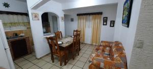 a kitchen and dining room with a table and chairs at Puerto Plata Home in San Felipe de Puerto Plata +24 photos