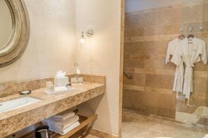a bathroom with a sink and a shower at Bastión Luxury Hotel in Cartagena de Indias