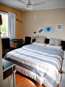 a bedroom with a large bed in a room at Microbed in Cipolletti