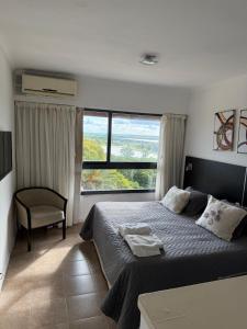 Postel nebo postele na pokoji v ubytování Apart Hotel 22 Rio Manso