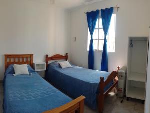 Postel nebo postele na pokoji v ubytování Patio Escondido