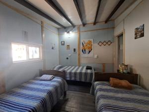 Ένα ή περισσότερα κρεβάτια σε δωμάτιο στο Cabaña 2 Atardecer Fandango