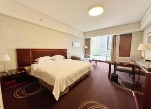 Postel nebo postele na pokoji v ubytování Beijing Chateau Lizhi Apartment Hotel + 98 fotografií
