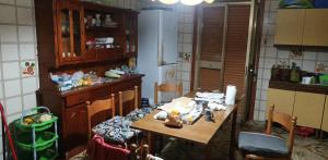 a kitchen with a table and a table and chairs at Margiii apart in Augusta