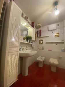 a bathroom with a sink and a toilet at B&B Fuori Dai Coppi - Bologna in Bologna +38 photos