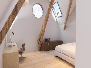 a bedroom with a bed and a desk and a window at Spacious 3-Floor Holiday Home for 8 Guests in Bree