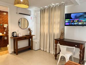 Μια τηλεόραση ή/και κέντρο ψυχαγωγίας στο Vila Saruê +63 φωτογραφίες