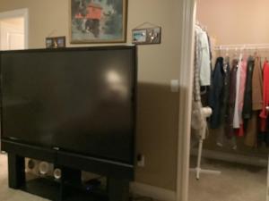a flat screen tv sitting in a closet at Barry and Elaine in Abbotsford +3 photos