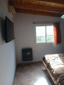 TV a/nebo společenská místnost v ubytování Casa quinta barrio real