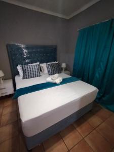 En eller flere senge i et værelse på Cottage 25