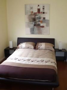 Giường trong phòng chung tại Emada Venus Bay