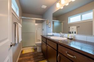 a bathroom with a sink and a toilet and a mirror at Boutique CDA Stay in Atlas