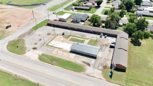 an overhead view of a building next to a street at Sawmill Lodges Motel in Hennessey