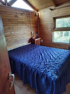 Ένα ή περισσότερα κρεβάτια σε δωμάτιο στο Cabaña Susana