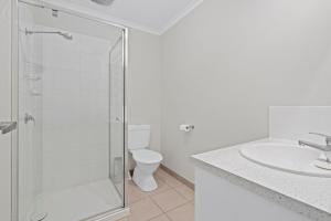 a bathroom with a shower and a sink and a toilet at Time to Relax in Portarlington +6 photos