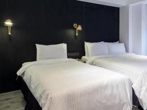 Katil atau katil-katil dalam bilik di Hotel Relax III