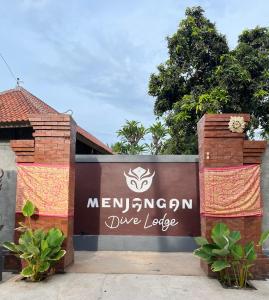 a sign for the entrance to a dye lodge at Menjangan Dive Lodge in Banyuwedang