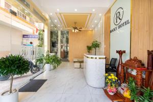 a lobby of a store with potted plants at Rocky Hotel Ho Chi Minh in Ho Chi Minh City