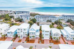 an aerial view of a residential neighborhood with the beach at Happily Eva After at Prominence 30A in Inlet Beach