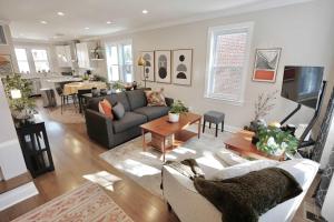 a living room with a couch and a table at The Brightwood House - Family Living in the Heart of DC in Washington