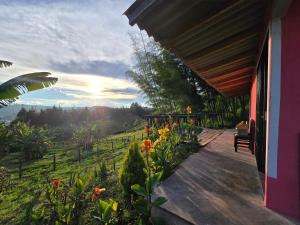 a porch of a house with a view of a field at Finca La Preciosura in Horizonte