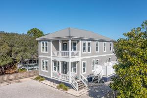 a large white house with a porch at IncogBeachO in Santa Rosa Beach +62 photos