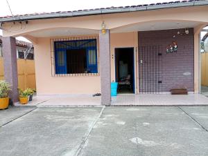a front porch of a house with a garage at Casa Mosqueiro in Belém
