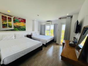 Postel nebo postele na pokoji v ubytování VANDA Hotel Nha Trang