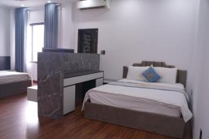 Ένα ή περισσότερα κρεβάτια σε δωμάτιο στο Winner Hotel