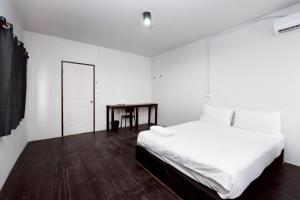 Ένα ή περισσότερα κρεβάτια σε δωμάτιο στο Mitr Inn Khaosan Street - มิตร อินน์ ตรอกข้าวสาร