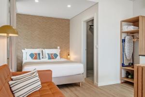 Postel nebo postele na pokoji v ubytování Modern Studio Steps From Beach + 5 fotografií