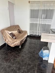 Ένα ή περισσότερα κρεβάτια σε δωμάτιο στο palawan holiday lodge