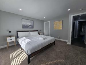 a bedroom with a large bed in a room at Quail Ridge 3BR House in Charlotte
