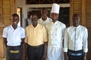 a group of four chefs posing for a picture at Auberge de Grand Popo in Grand-Popo