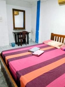 Ένα ή περισσότερα κρεβάτια σε δωμάτιο στο Lake Front Hotel IDH