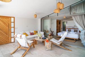 a living room with a couch and a bed at Villa Olympia 2br Sea View Pool Breakfast in Ban Bang Po +30 photos