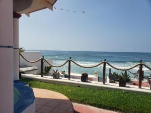 a view of the ocean from a resort balcony at Exotic Oceanfront villa with Private Pool & jacuzzi - Parties & Events in Rosarito