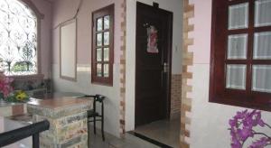 a room with a black door and a window at Timi Hotel in Ho Chi Minh City +36 photos