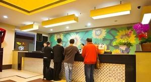 a group of people waiting at a counter in a restaurant at Kui Chong Holiday Hotel in Tongshi