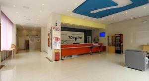 a lobby with a ticks inc store in a mall at 7 Days Inn Fucheng Wu Gongci Gaodeng East Street Binjiang Road in Haikou